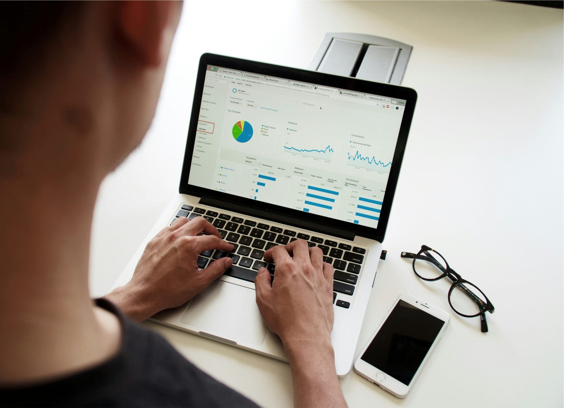 Man analyzing data on a laptop.